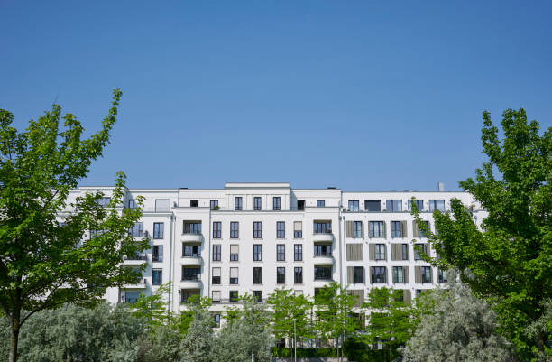 istock Modern white town houses and trees 2152878001
