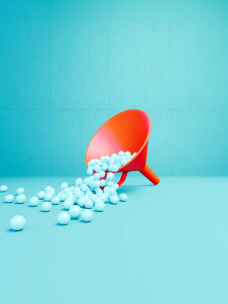 Coral Colored Funnel Filled With Spheres Before Blue Background