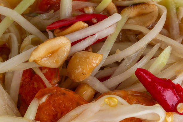 Thai food appetizer papaya salad with peanuts, chili and lime Som Tam