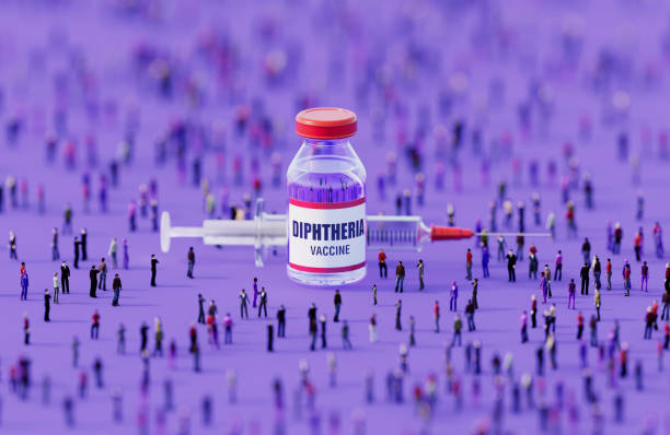 istock Human Crowd Surrounding An Injectable Diphtheria Vaccine Bottle On Purple Background 2152881366
