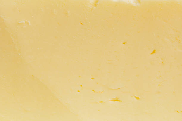 istock Sliced butter texture yellow background. Macro shot. 2152882326