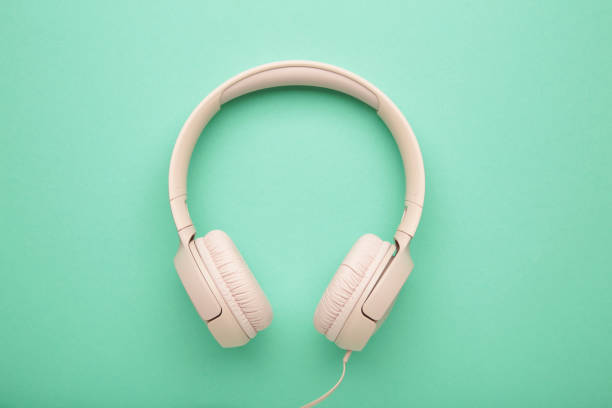 istock Pink modern headphones on a mint background 2152883011