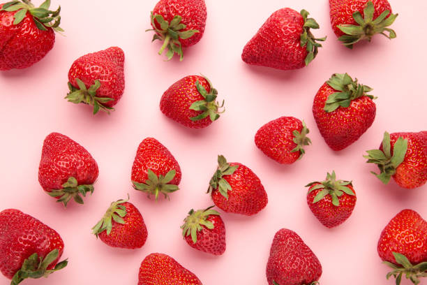 istock Red strawberry on pink background. Macro photo 2152883149