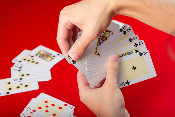 istock Board game. Playing cards. poker cards in a young mans hand. 2152884109