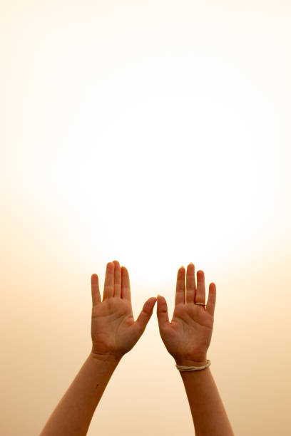 istock hands of a praying girl 2152884332