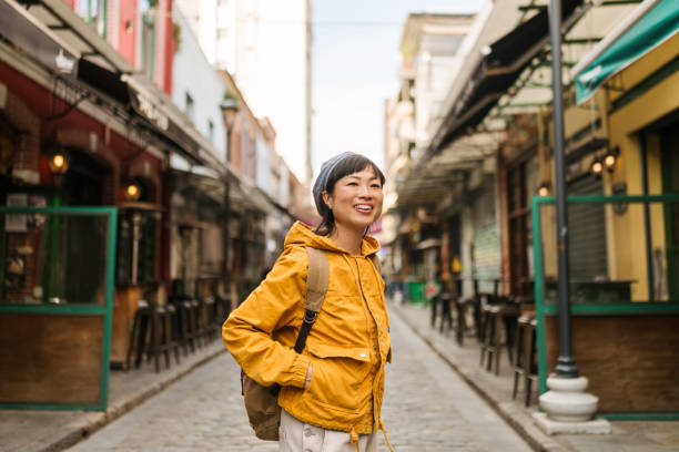 istock Asian woman exploring the new city while on a vacation 2152884496