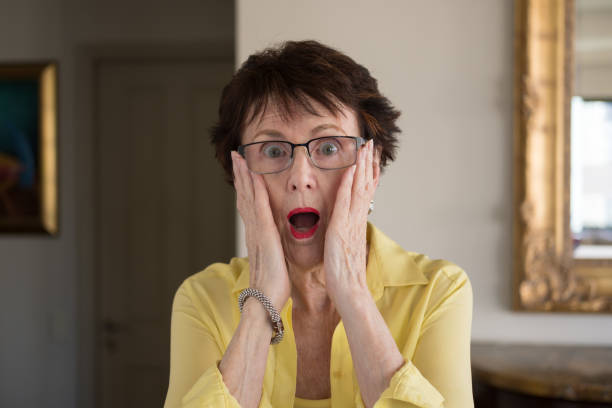 istock Senior woman at home with a surprised expression 2152885489