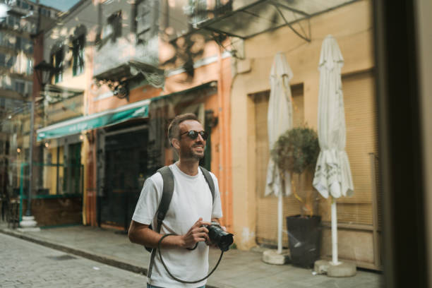 istock Male photographer exploring the new city while on a vacation 2152888922