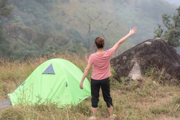 istock Hiker asian woman backpack walking trail activity camping outdoors and People exploring forest green natural capturing beauty nature outdoor. 2152891821