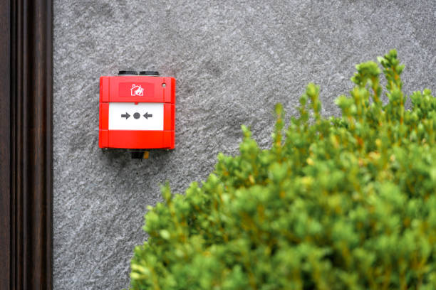 Full front view of outdoor wall mounted fire alarm button