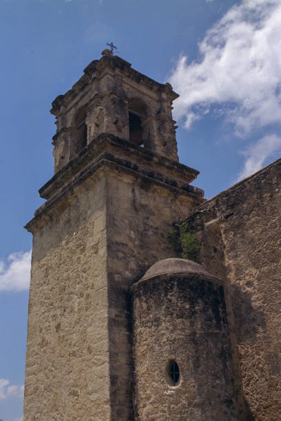 istock Time-worn elegance: An ancient bell tower stands watch under a serene sky. 2152893633