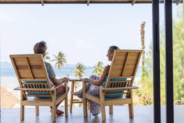 istock Couple Relaxing on Balcony with Ocean View 2152893653