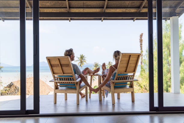 istock Couple Holding Hands on Balcony with Ocean View 2152894579