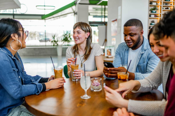 istock Multiracial group of friends having a coffee together 2152895488