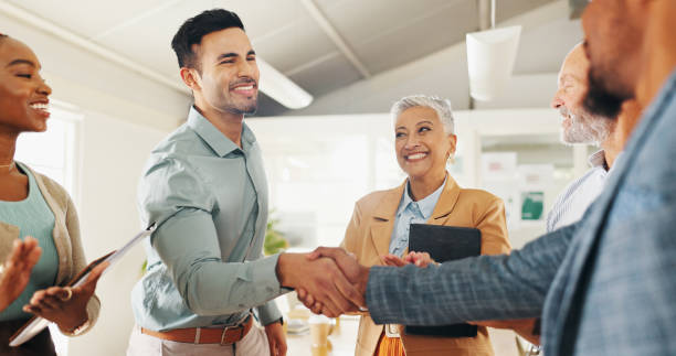 istock Welcome, handshake or business people with applause in office celebration for interview, onboarding or recruitment success. Thank you, praise and team clapping for man shaking hands for hr contract 2152907609