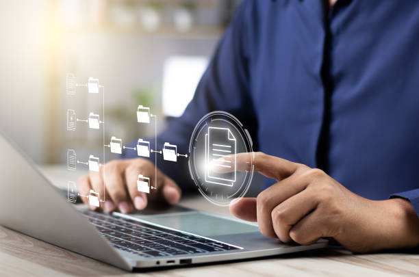 istock Document management system concept (DMS), Businessman working laptop virtual screen icons folder and document management system, Software for archiving, Searching and managing files corporate document 2152909206