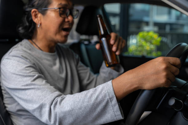 istock That's a dangerous thing to do. Drinking beer while driving is both illegal and unsafe. 2152913922