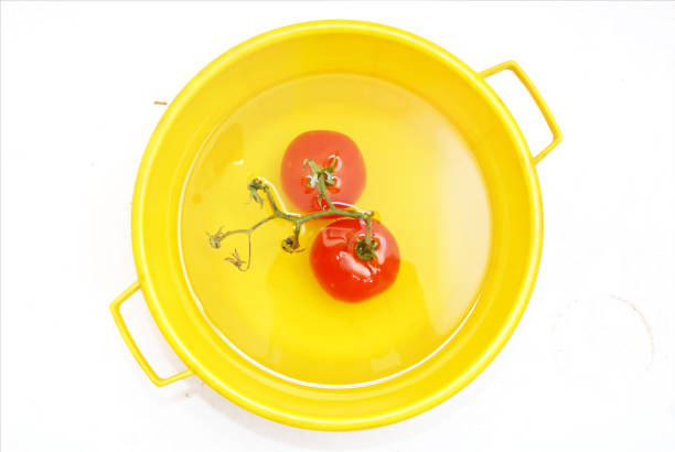 Tomato in the washing bowl.