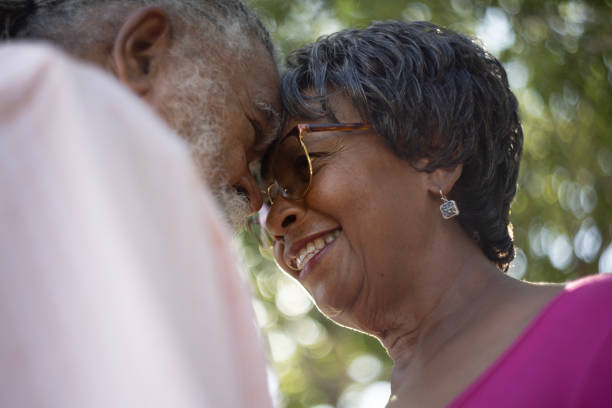A happy senior couple in love, enjoying life together outdoors.