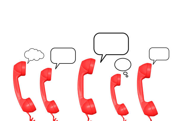 Red telephone handsets with blank speech bubbles on a white background with copy space
