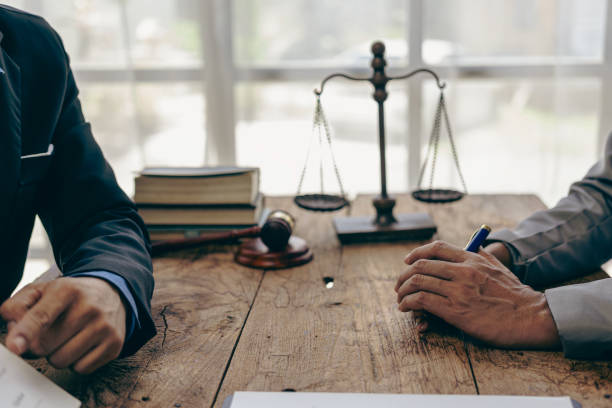 istock Lawyer working with client discussing contract documents with legal brass in consulting office to help client, close-up photo 2152918510