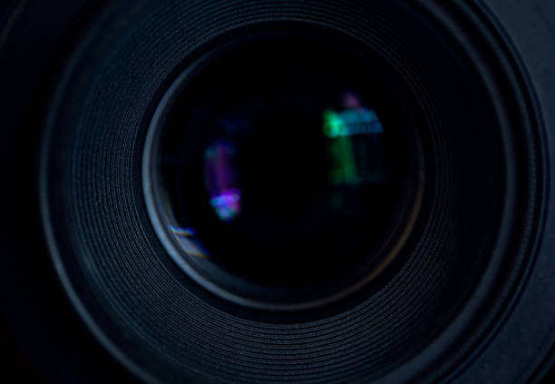 close-up camera lens,Photo Camera or Video lens close-up on black background, objective, concept of photographer camera man job, looking for a photographer,