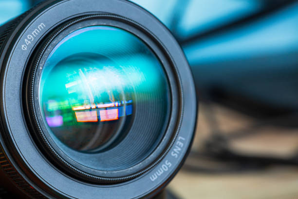 istock close-up camera lens,Photo Camera or Video lens close-up on black background, objective, concept of photographer camera man job, looking for a photographer, 2152922517