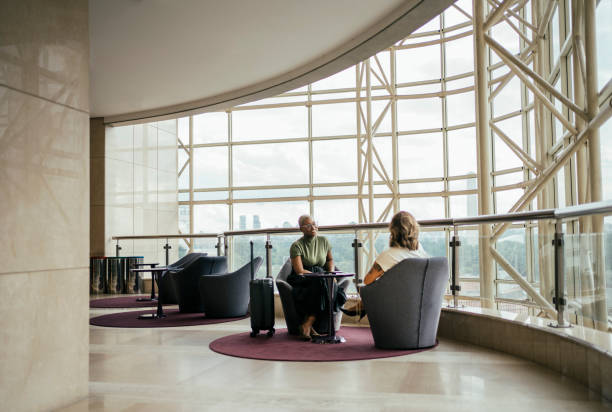 Business women discussing a project in hotel lobby