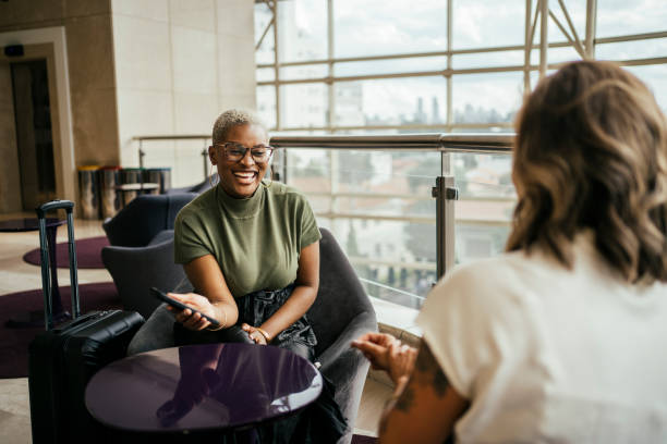 Business women discussing a project in hotel lobby