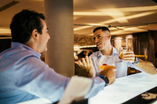 istock Coworkers talking at the hotel bar 2152923383