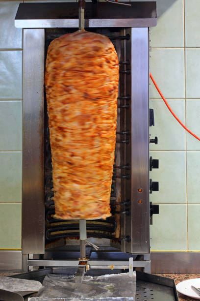 large Kebab skewer with meat that rotates on itself with a movement effect in the eating area