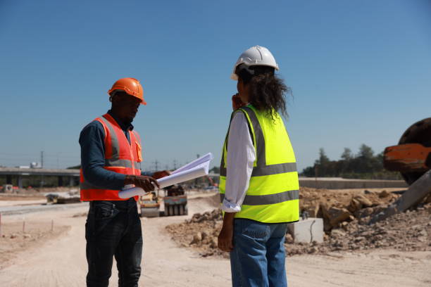 istock Engineers are having a meeting regarding the new construction phase. two construction workers sitting together at the site 2152927212