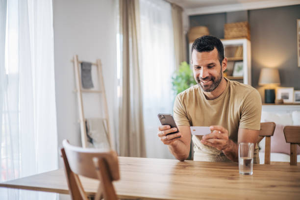 istock A man is shopping online at home 2152927934