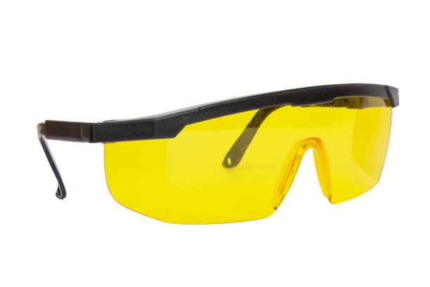 istock yellow safety glasses isolated on white background. 2152928233