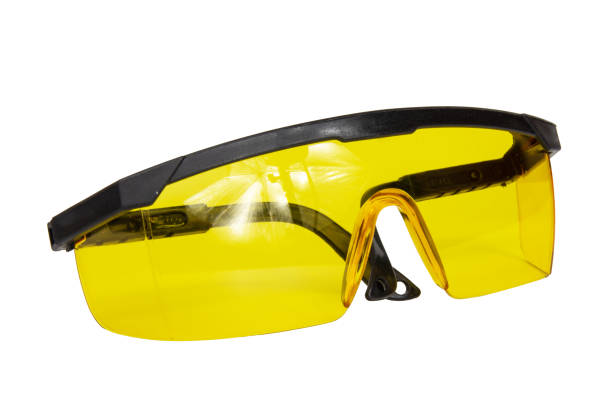 istock yellow safety glasses isolated on white background. 2152928274