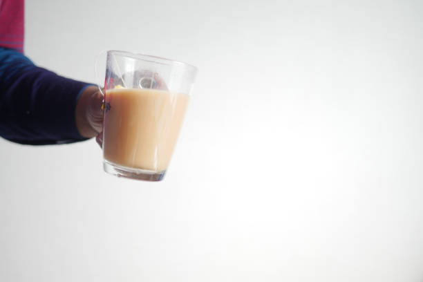 istock hand holding a glass of milk tea 2152931519