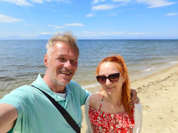 istock Couple taking a selfie on beach 2152933942