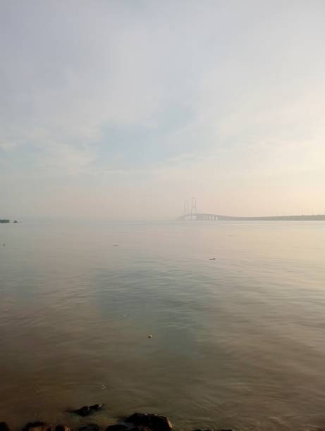 sea ​​with fog and “suramadu” bridge with blurred background