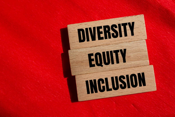 istock Diversity, equity and inclusion words written on wooden blocks with red background 2152944484
