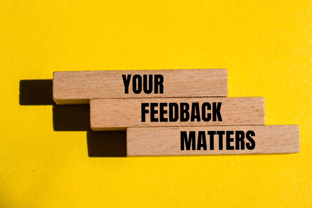 istock Your feedback matters written on wooden blocks with yellow background 2152944657