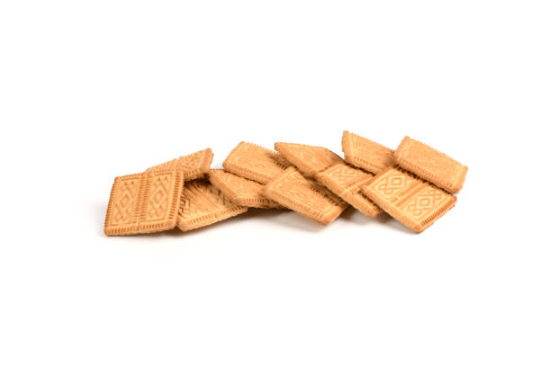 Square shortbread cookies isolated on white background. Stacked butter biscuits for coffee or tee. High resolution photo. Full depth of field.