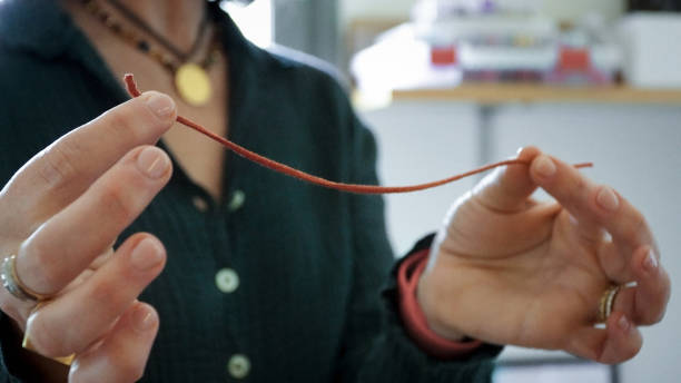 istock close up woman measuring thread 2152945290