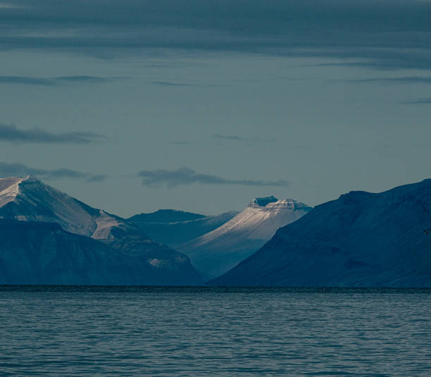 istock Snow-capped mountains with striations at dusk, Longyearbyen, Svalbard 2152945670