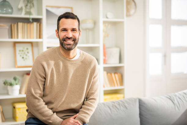 Portrait of young man at home