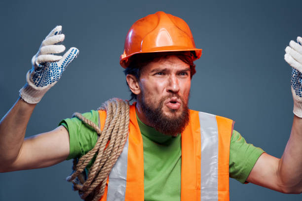 istock emotional man in work uniform safety professional blue background 2152948993