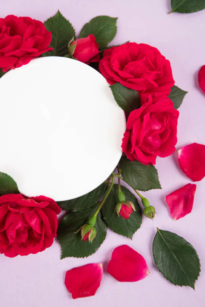 istock Empty podium with rose flowers on pink background 2152949157