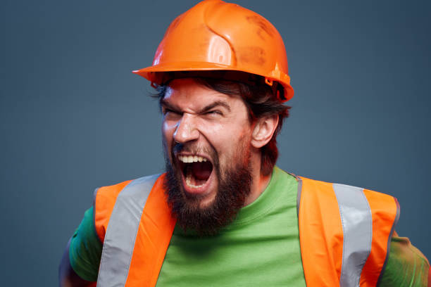 istock emotional man worker orange paint hard work 2152949170
