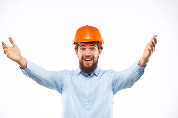 engineer in orange safety helmet in construction emotions professional lifestyle. High quality photo