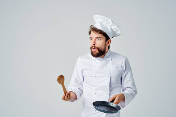 istock professional chef frying pan in hands restaurant kitchen 2152950153
