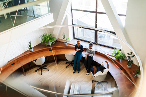 istock Colleagues having coffee brake and chatting at the office 2152950542